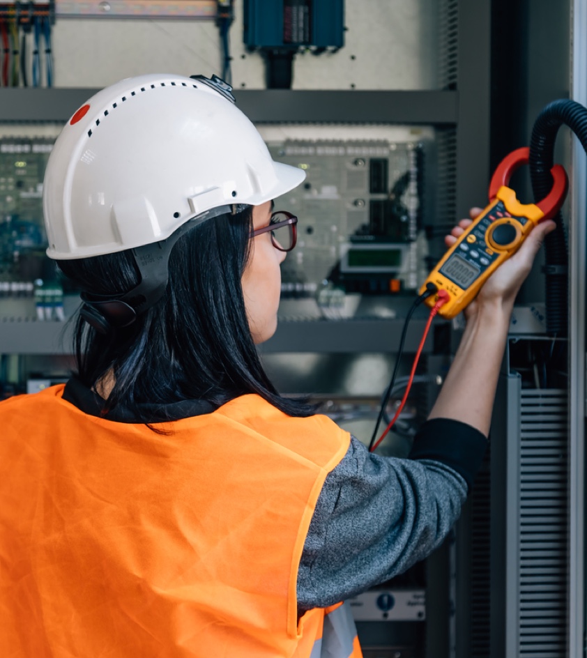 Engineer testing voltage