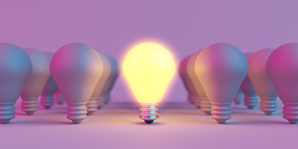 Illuminated light bulb standing Out in Crowd. Creative idea and inspire innovation. 3d rendering